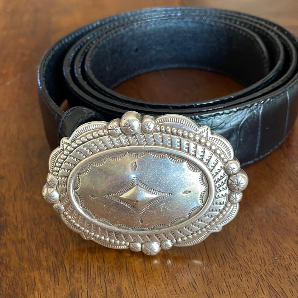 Black leather belt with silver buckle. Size 3X 49” long